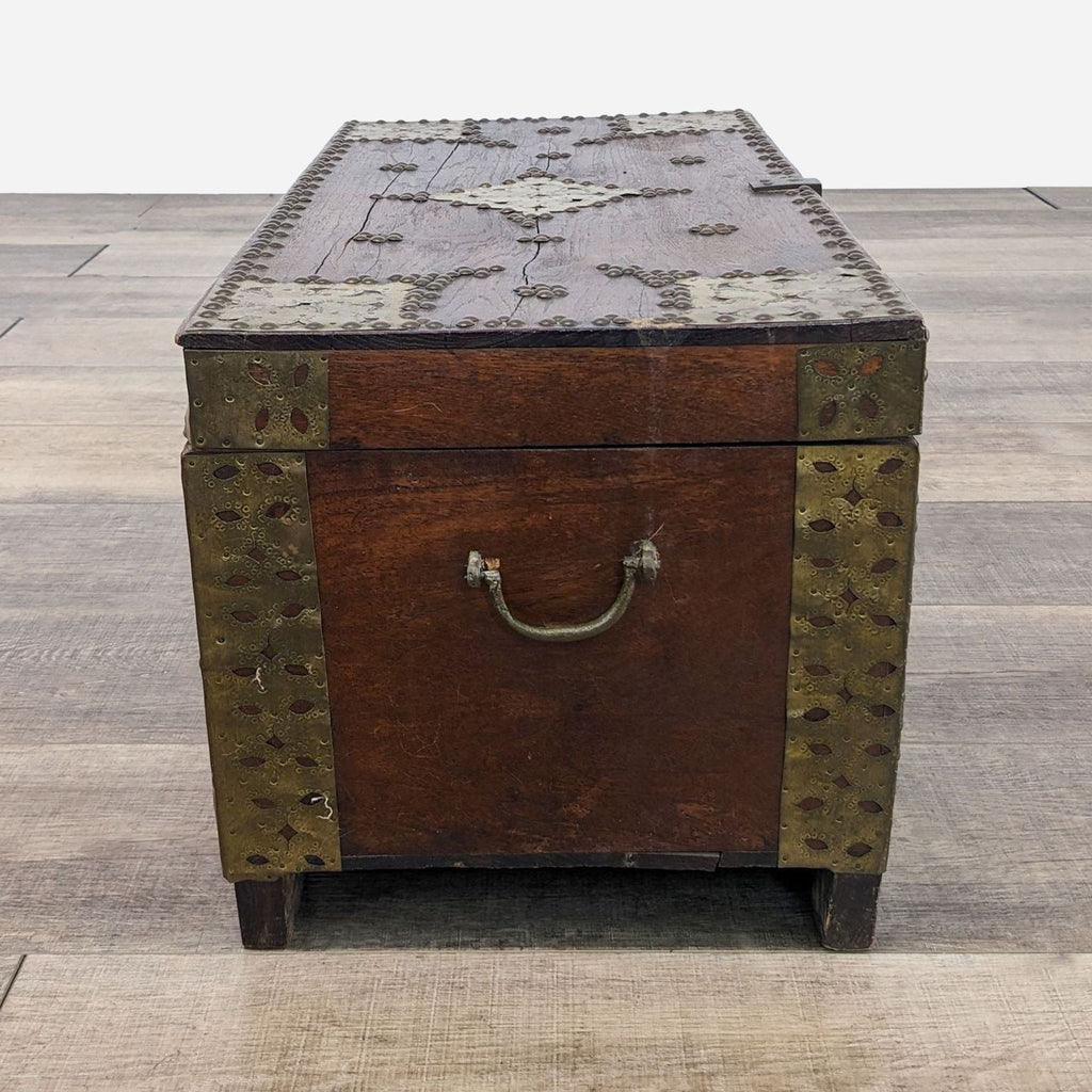 a large, antique, brass and leather chest, circa 1900.