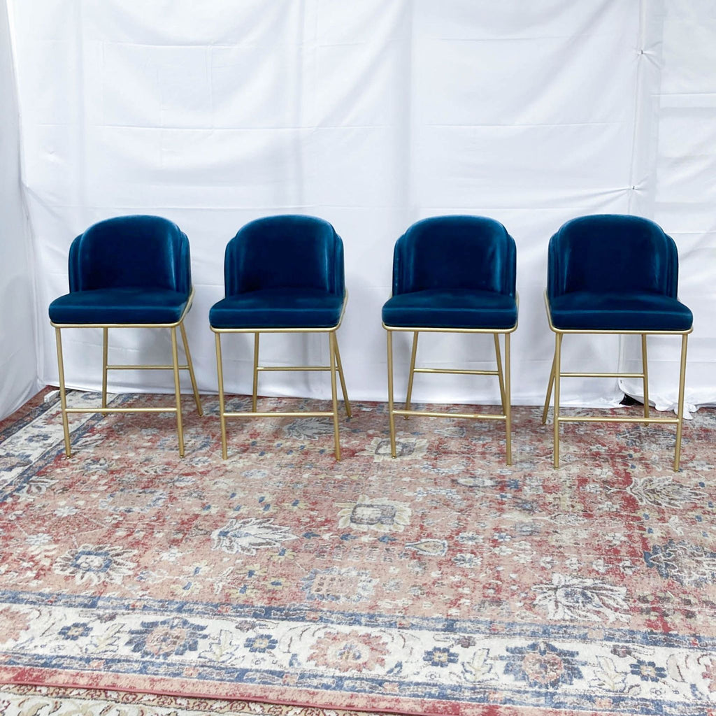 a set of four velvet dining chairs