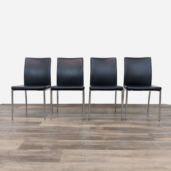 a set of four black leather dining chairs, 1970s.