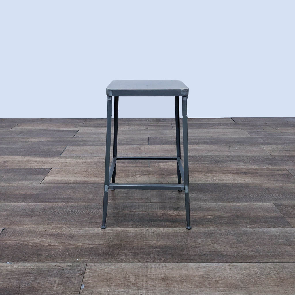 a stool with a metal seat.