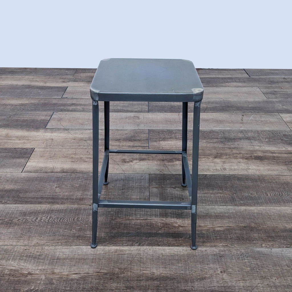 a small stool with a metal frame.