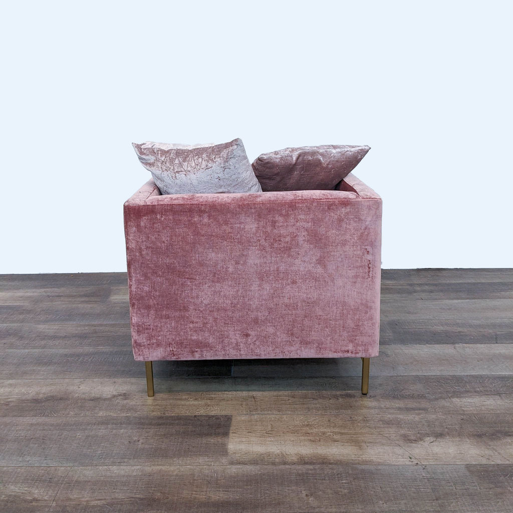 Back view of rosewood-upholstered Emma chair with matching throw pillows and wood legs.