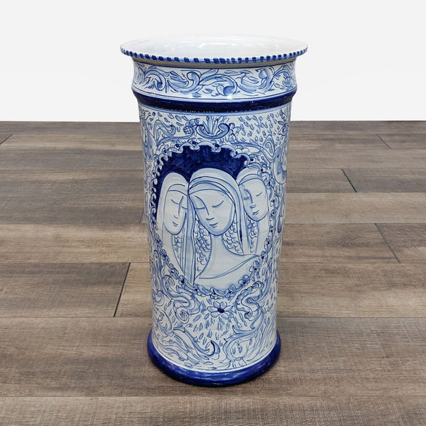blue and white porcelain vase with a woman's face
