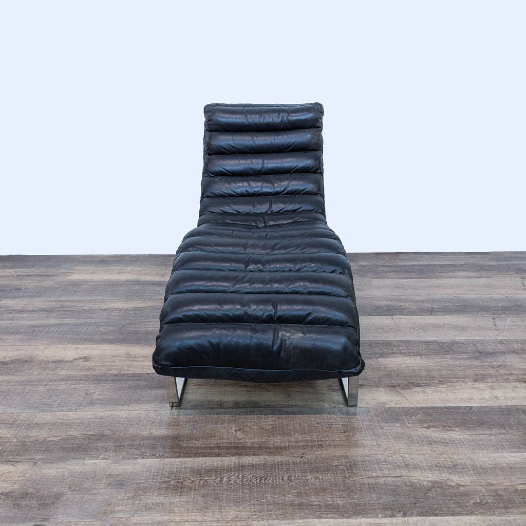 Front view of the Oviedo Chaise Lounge highlighting the channel-stitched leather cushion and sleek base.