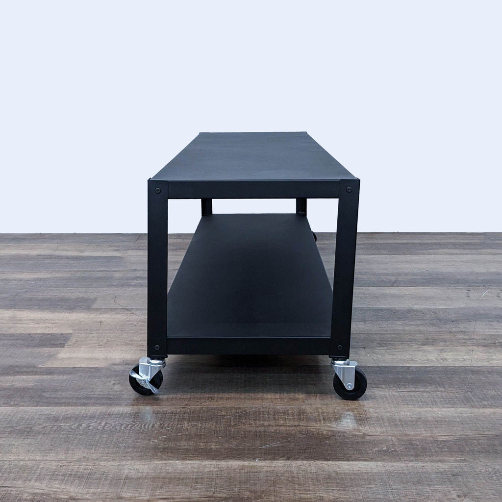 the table is made of a black metal frame with a black top.