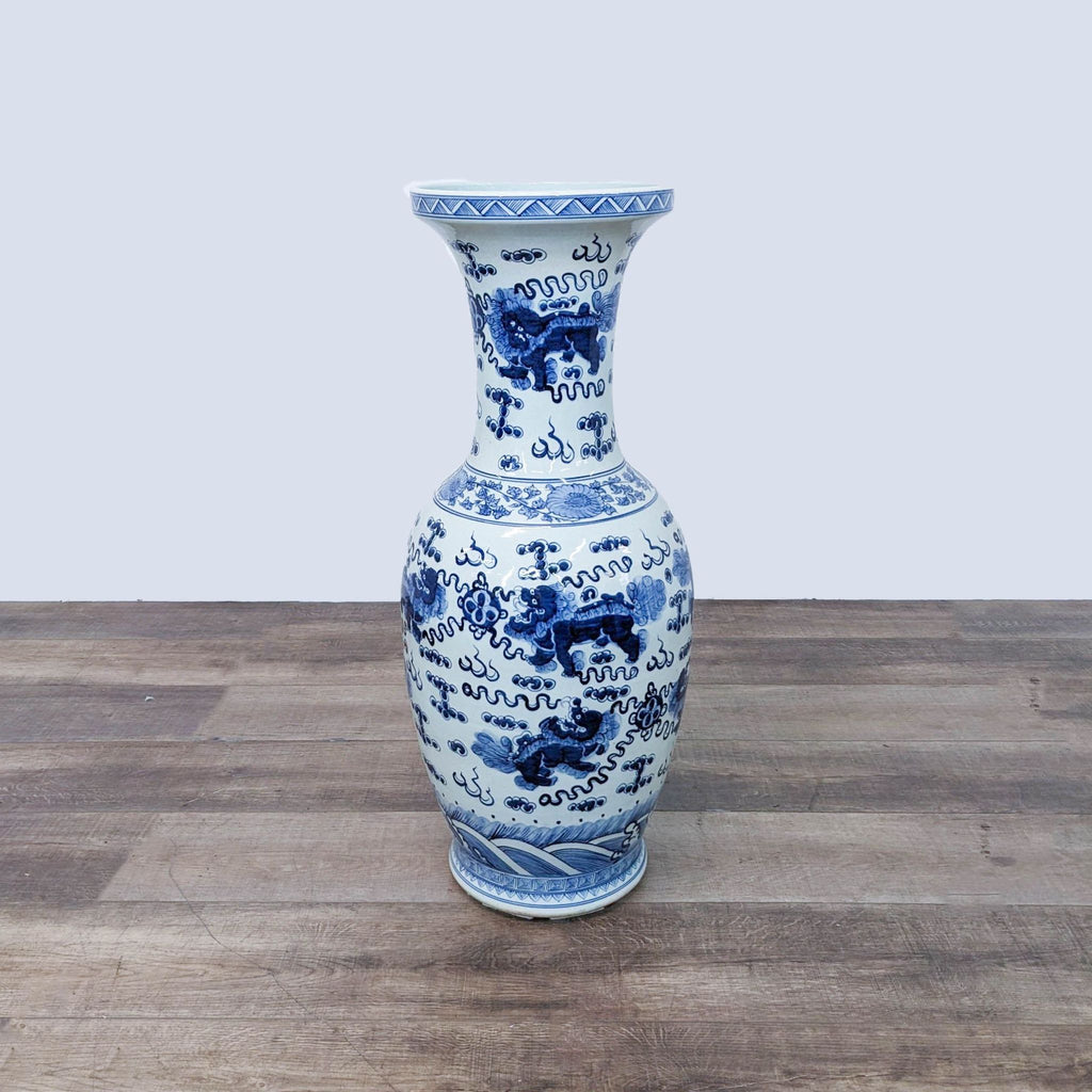 a blue and white vase with a white and blue design.