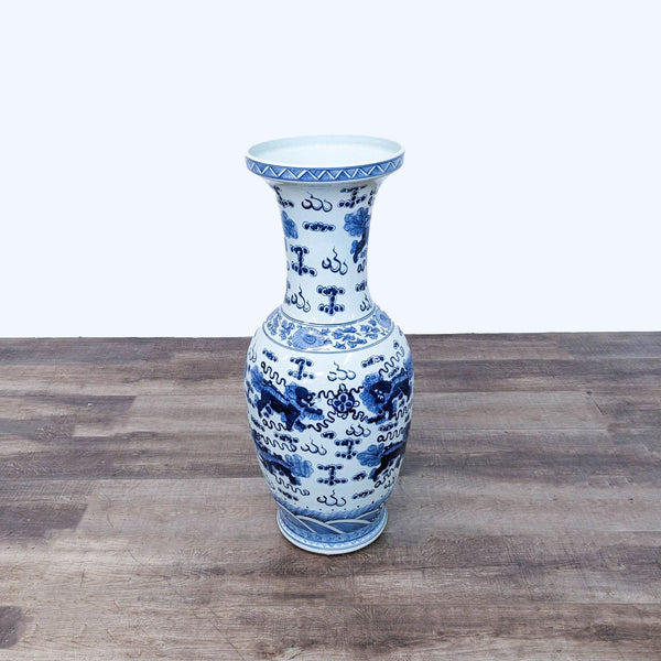 a blue and white vase with a white and blue design.