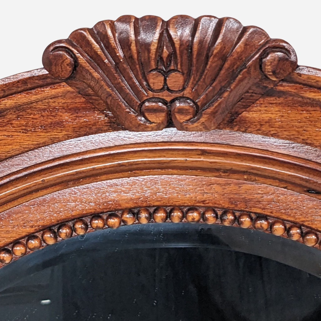 a [ unused0 ] style mirror with a carved wood frame