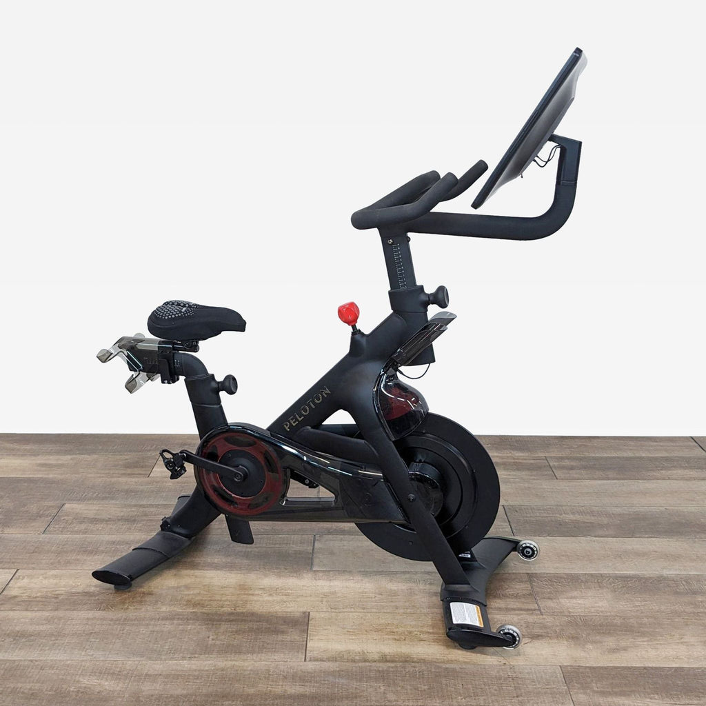 Sleek Peloton stationary bike featuring adjustable resistance and a high-definition screen for live workouts.