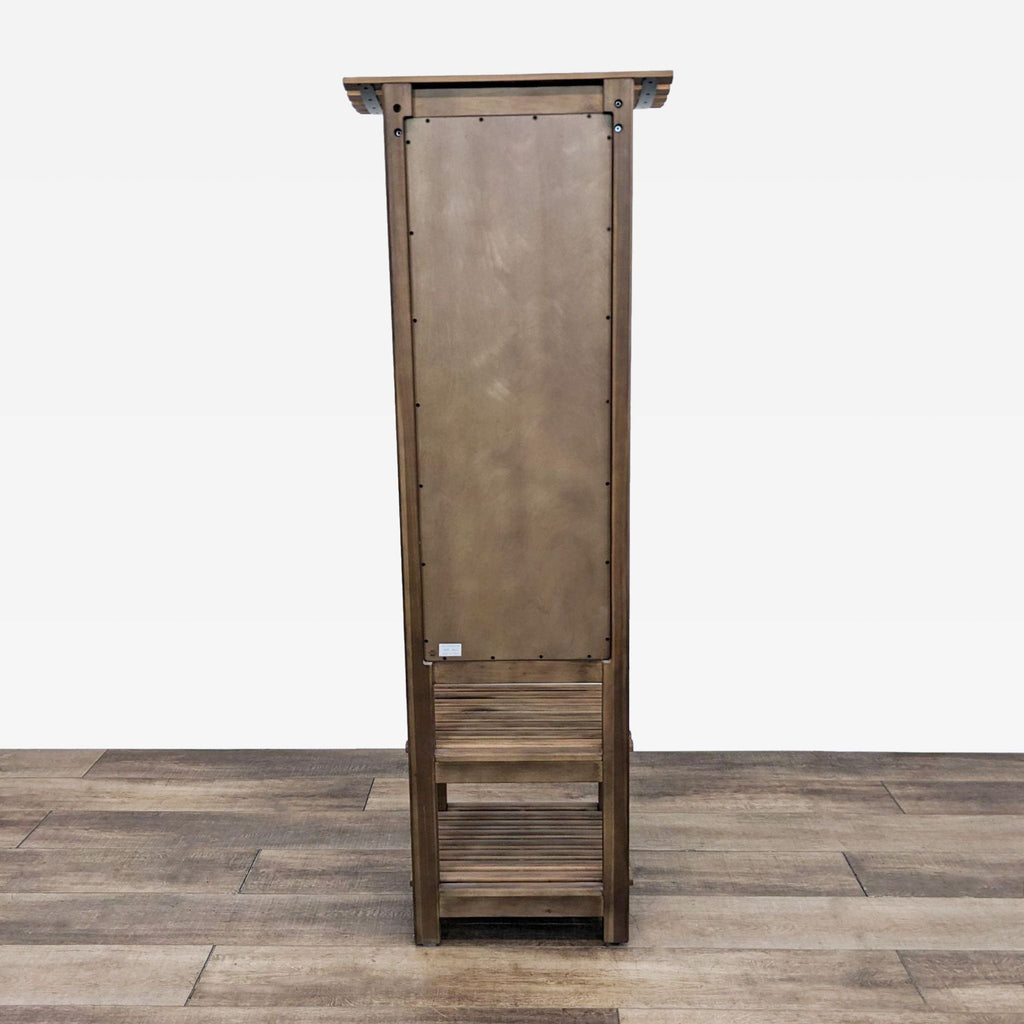 Rear view of a wooden hall tree with visible back panel and lower shelf storage.