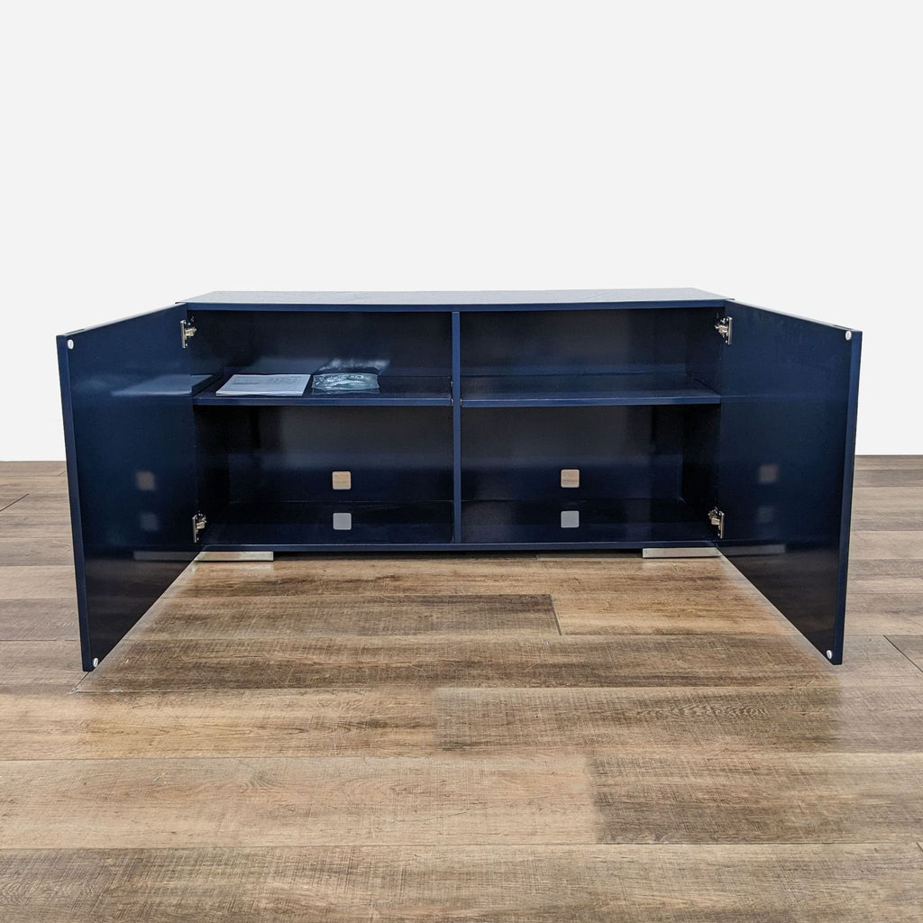 a large blue metal coffee table with shelves.