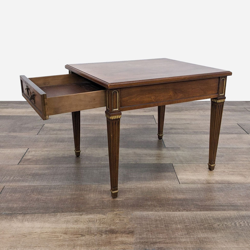 a french mahogany side table with a drawer