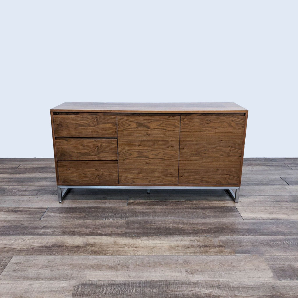 Front view of a walnut-finished Gus dresser with a stainless steel base.