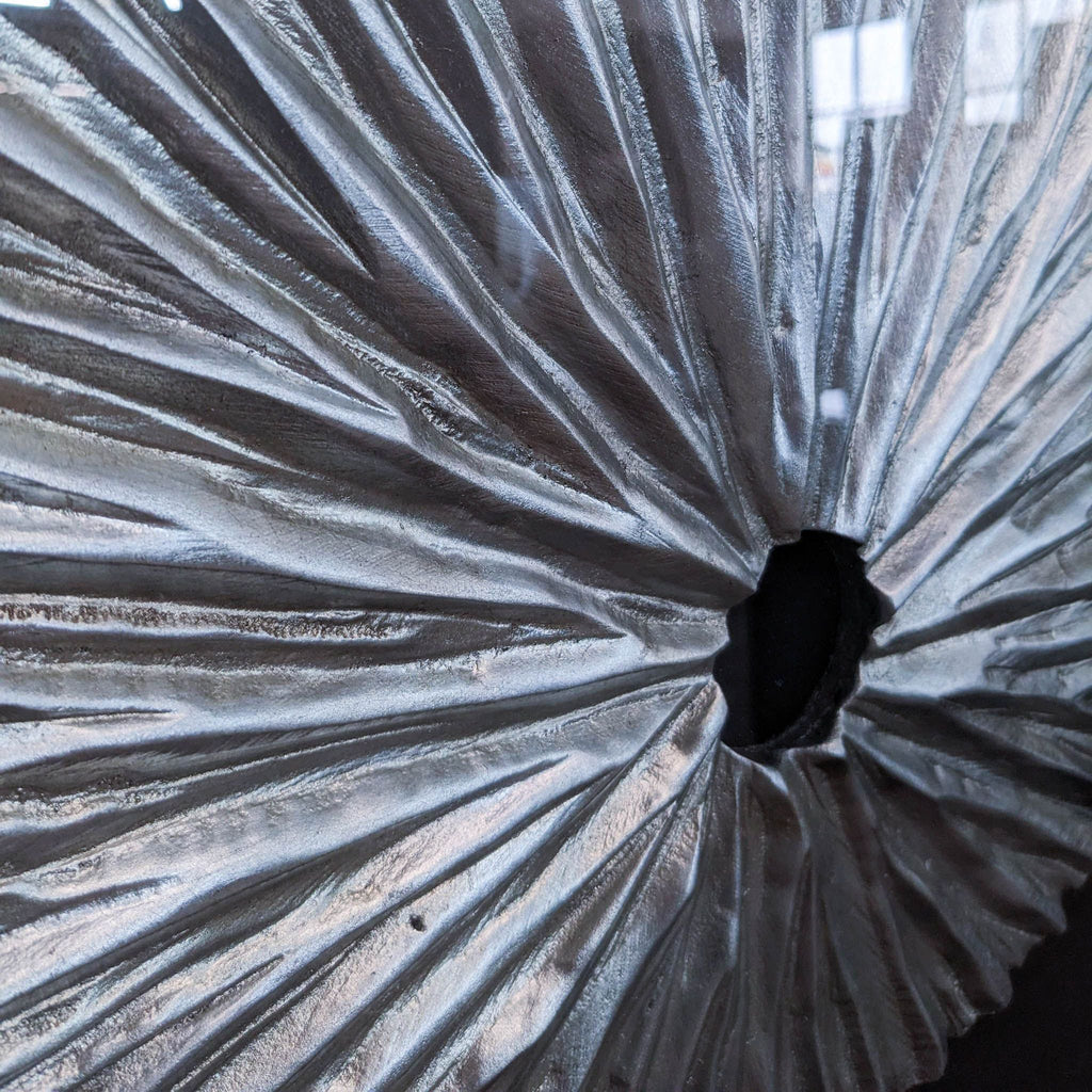 a metal curtain with a hole in the middle