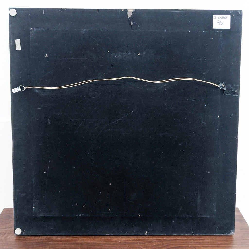 a black metal box with a white label on the front.