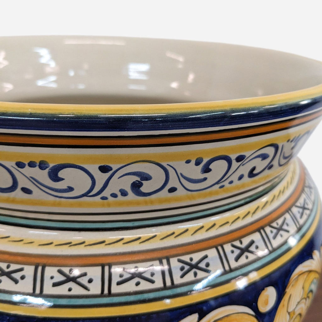 a large ceramic bowl with a blue and yellow design.