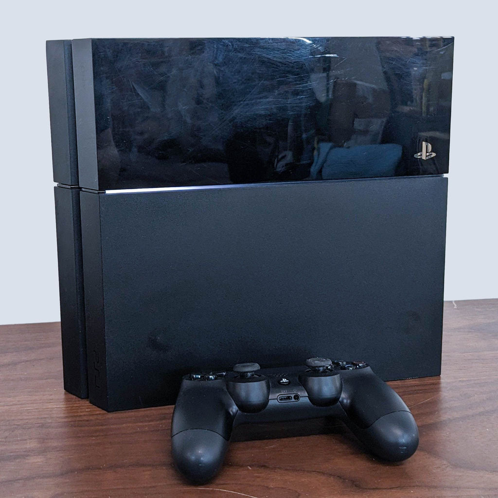 the playstation 4 console is on a table.