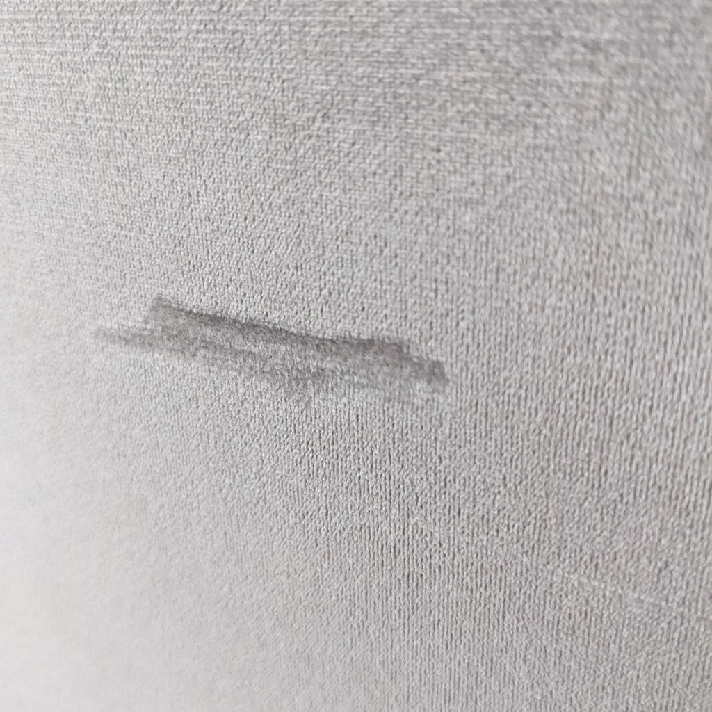 a close up of a piece of fabric on a bed