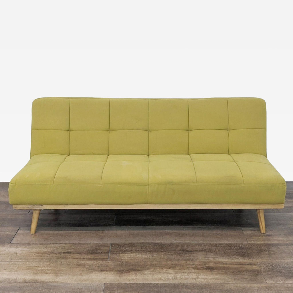 a green sofa in the style of [ unused0 ]