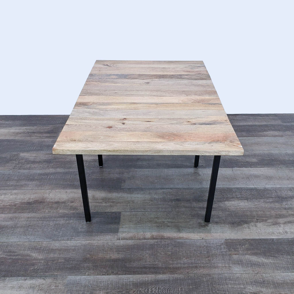 a coffee table with a black metal frame.