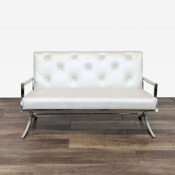 a chrome and leather sofa by [ unused0 ].