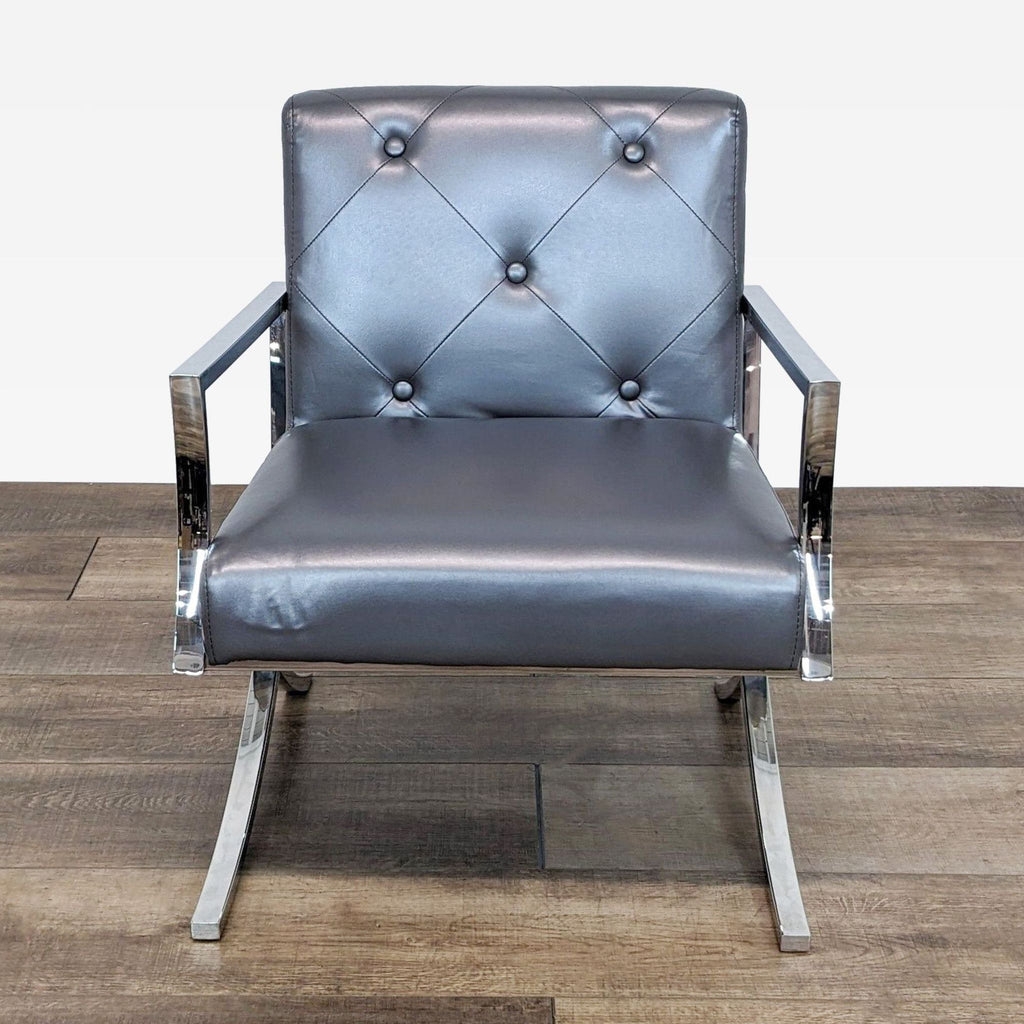 a pair of chrome and leather lounge chairs