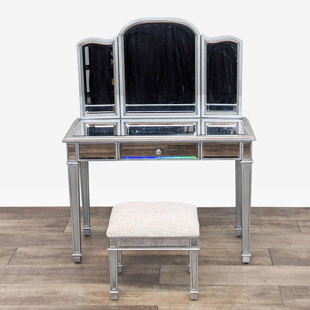 a mirrored dressing table with a stool and stool.