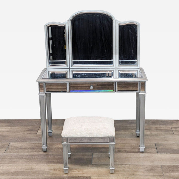 a mirrored dressing table with a stool and stool.