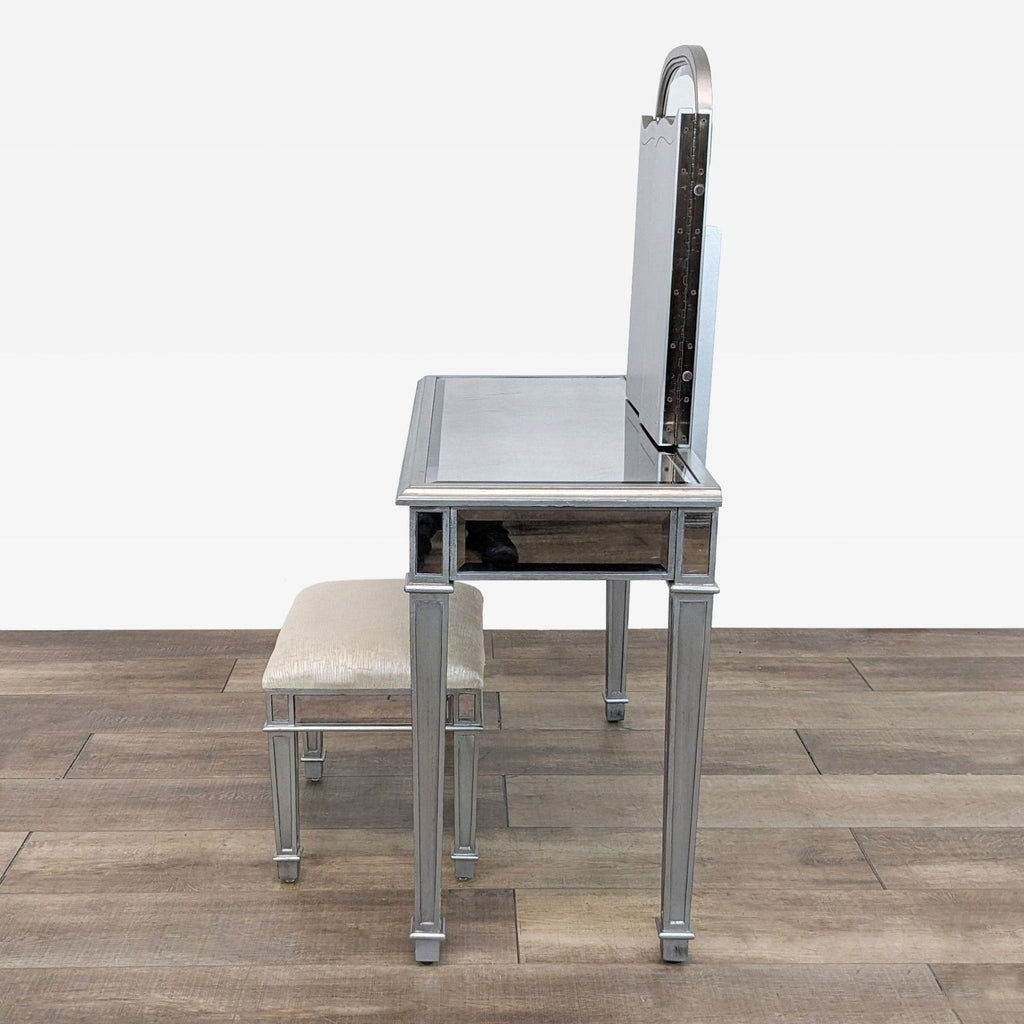 a chrome table with a stool and a stool.