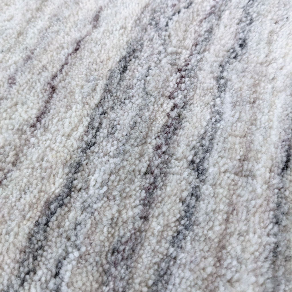 Close-up of the Shale Striations Rug texture, highlighting the intricate hand-loomed polyester fibers.