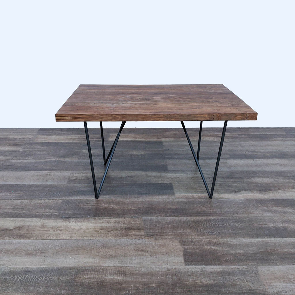 the coffee table is made from a walnut wood with a steel frame.