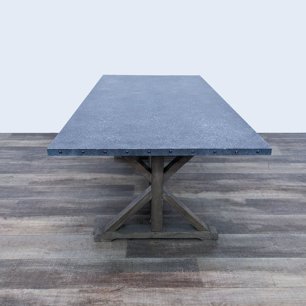 a large, rectangular, rectangular, concrete table with a black base.