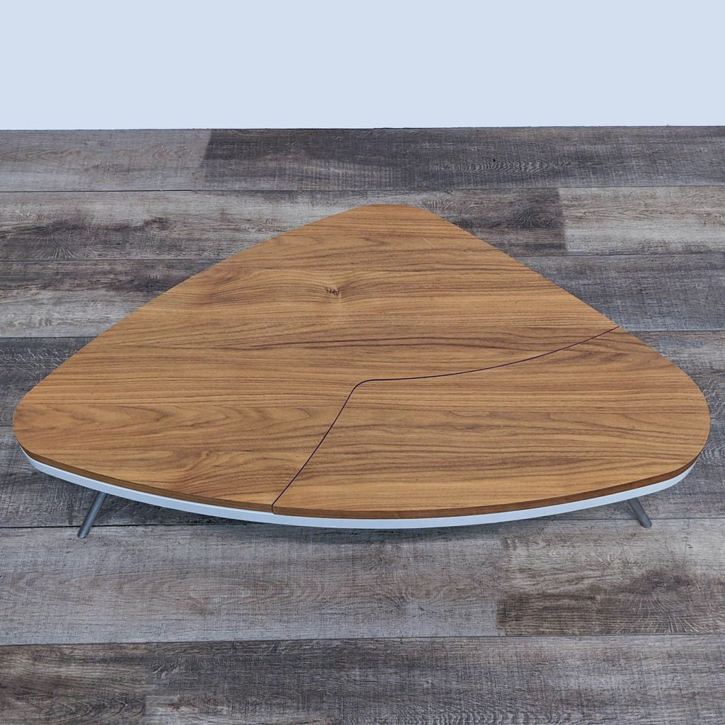 the table top is made from a walnut wood with a walnut finish.