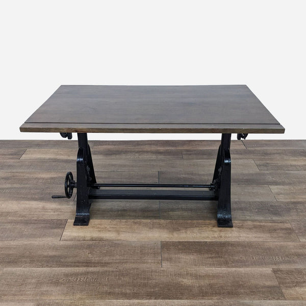 the industrial coffee table is made from a solid wood and has a black base.