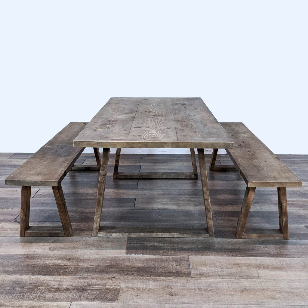 a rustic wooden table with a bench