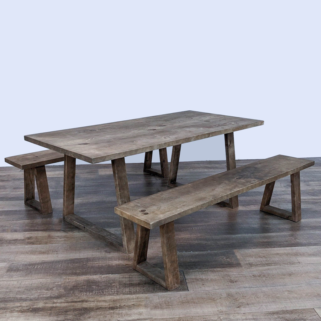 a rustic wooden picnic table with two benches.