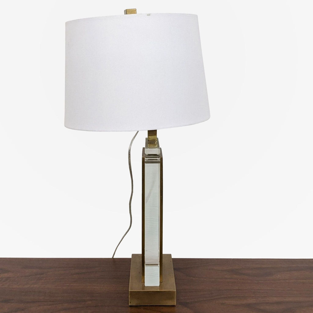 a mid century modern table lamp with a white shade.