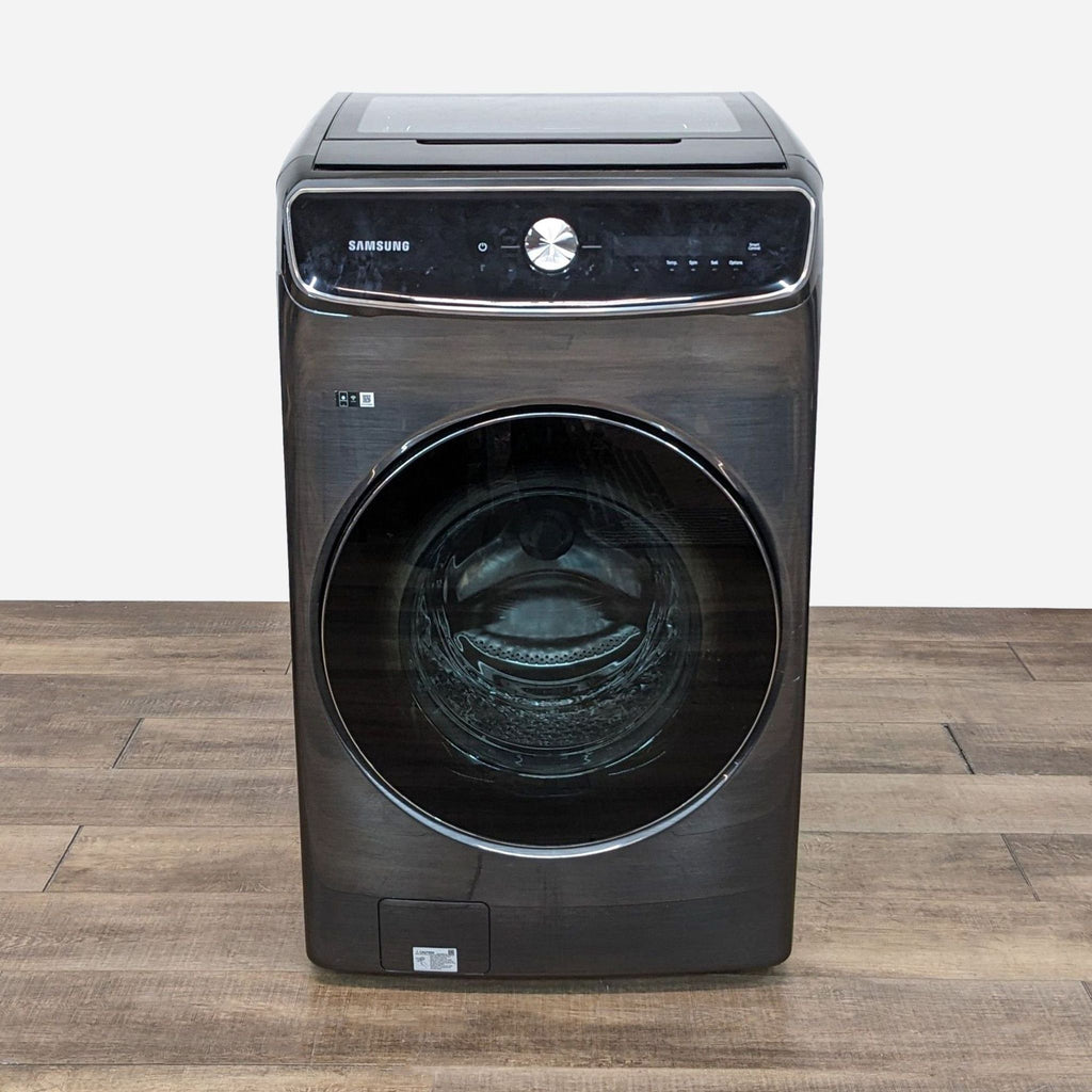 a washing machine on a wooden table.