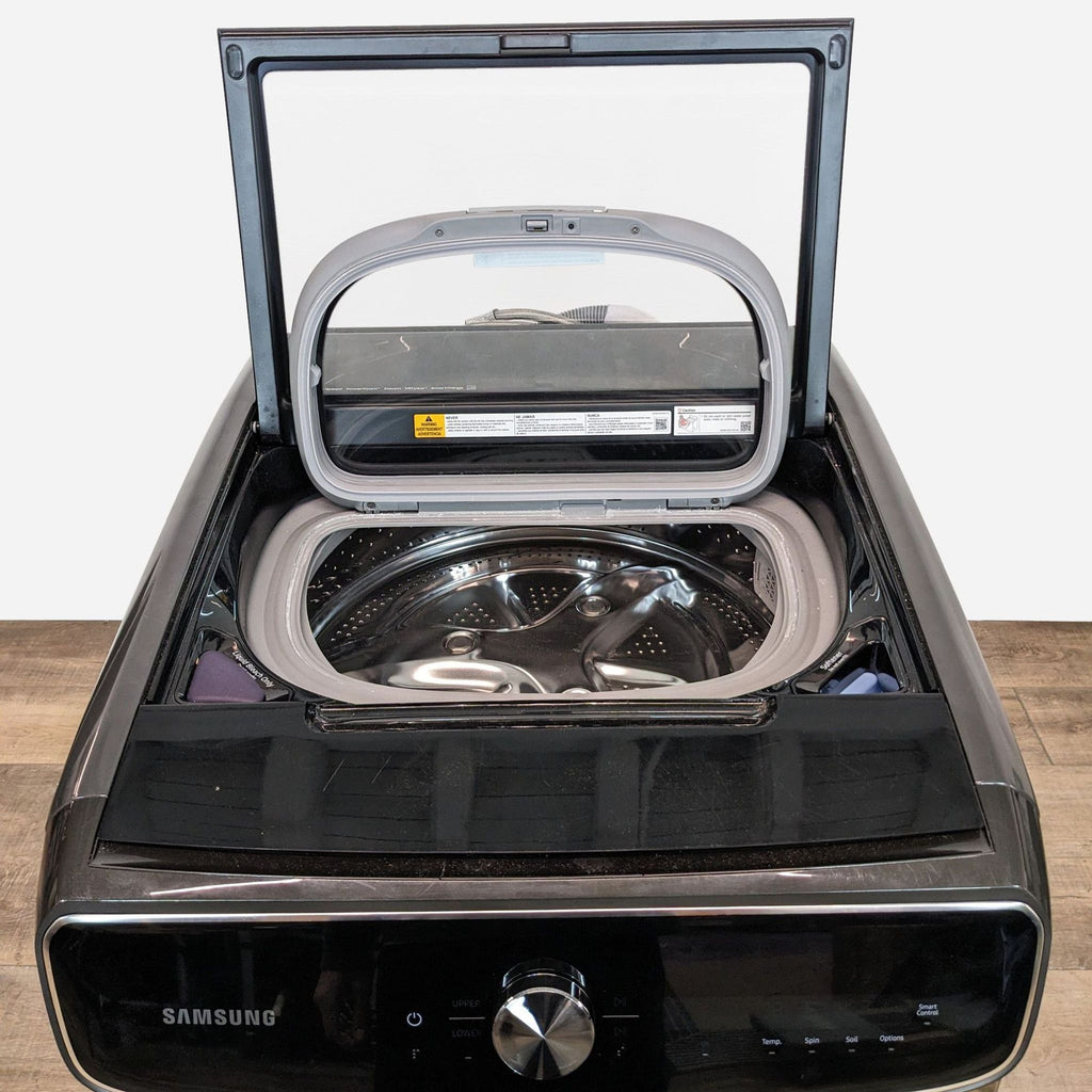 a black samsung washing machine with a lid open.