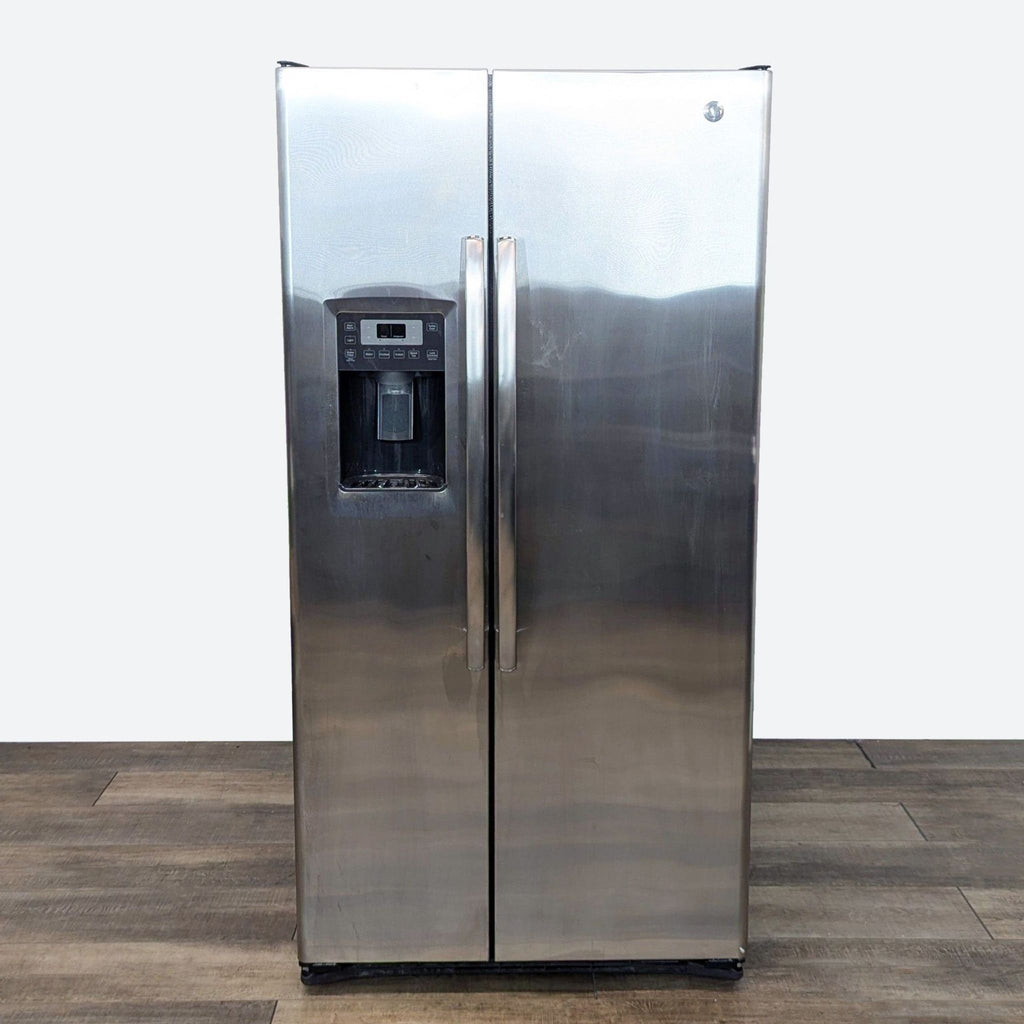 a stainless steel refrigerator with a water dispenser.