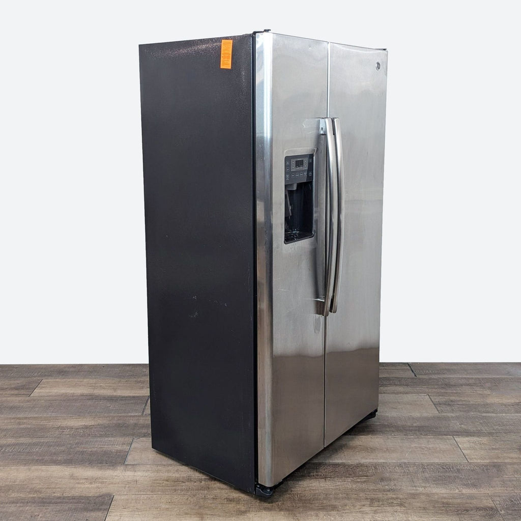 a stainless steel refrigerator with a black front.