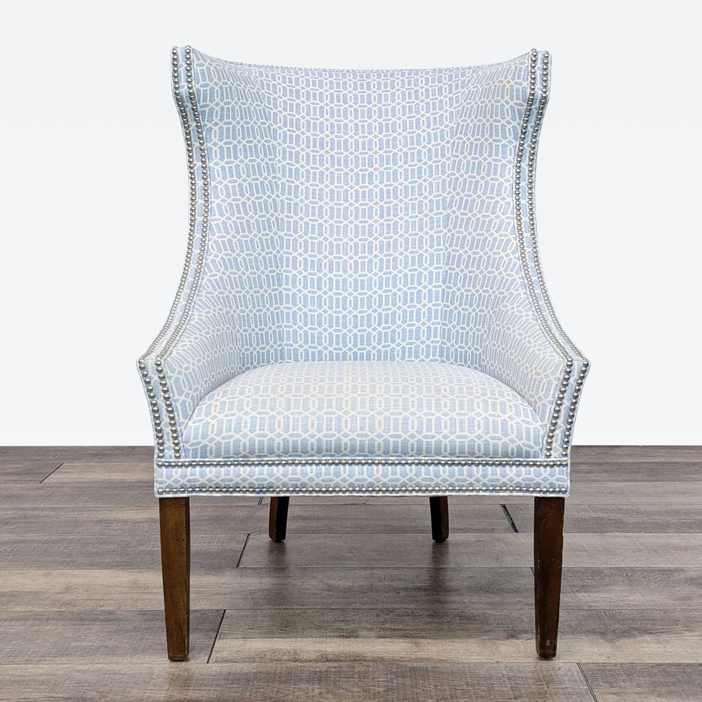 a blue and white chair with a geometric pattern