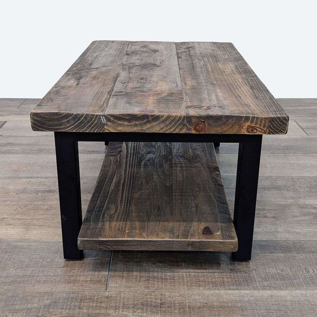 Front view of Reperch's wooden coffee table, highlighting the thick tabletop and metal legs.