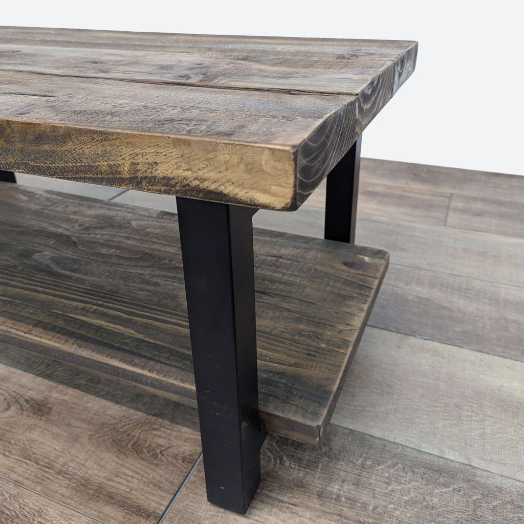 Close-up of the Reperch coffee table's wood-grain texture and sturdy metal frame.