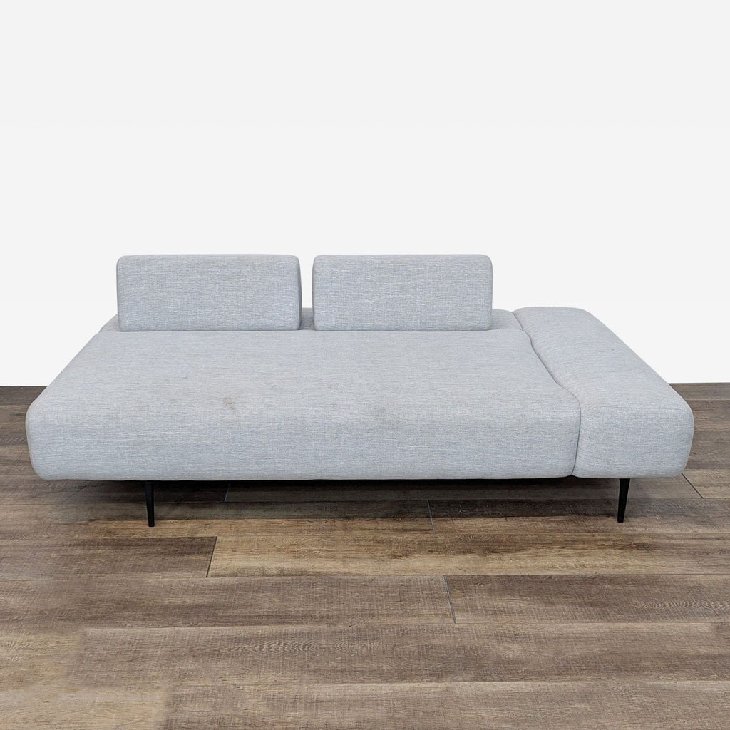 sofa in a modern style with a black metal frame.