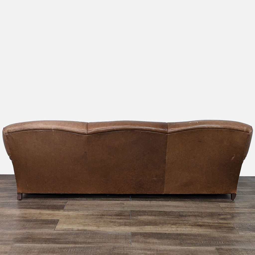 Back view of Ralph Lauren leather sofa, showcasing curves.