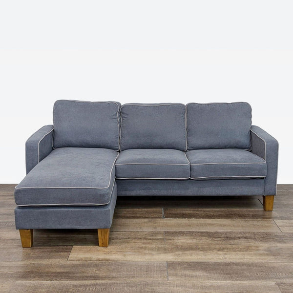 Modern Dorel sectional sofa with track arms, chenille fabric, beige trim, and light walnut wood feet.