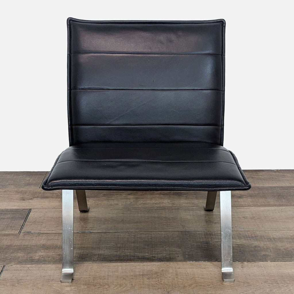 a set of four black leather dining chairs in the style of [ unused0 ]