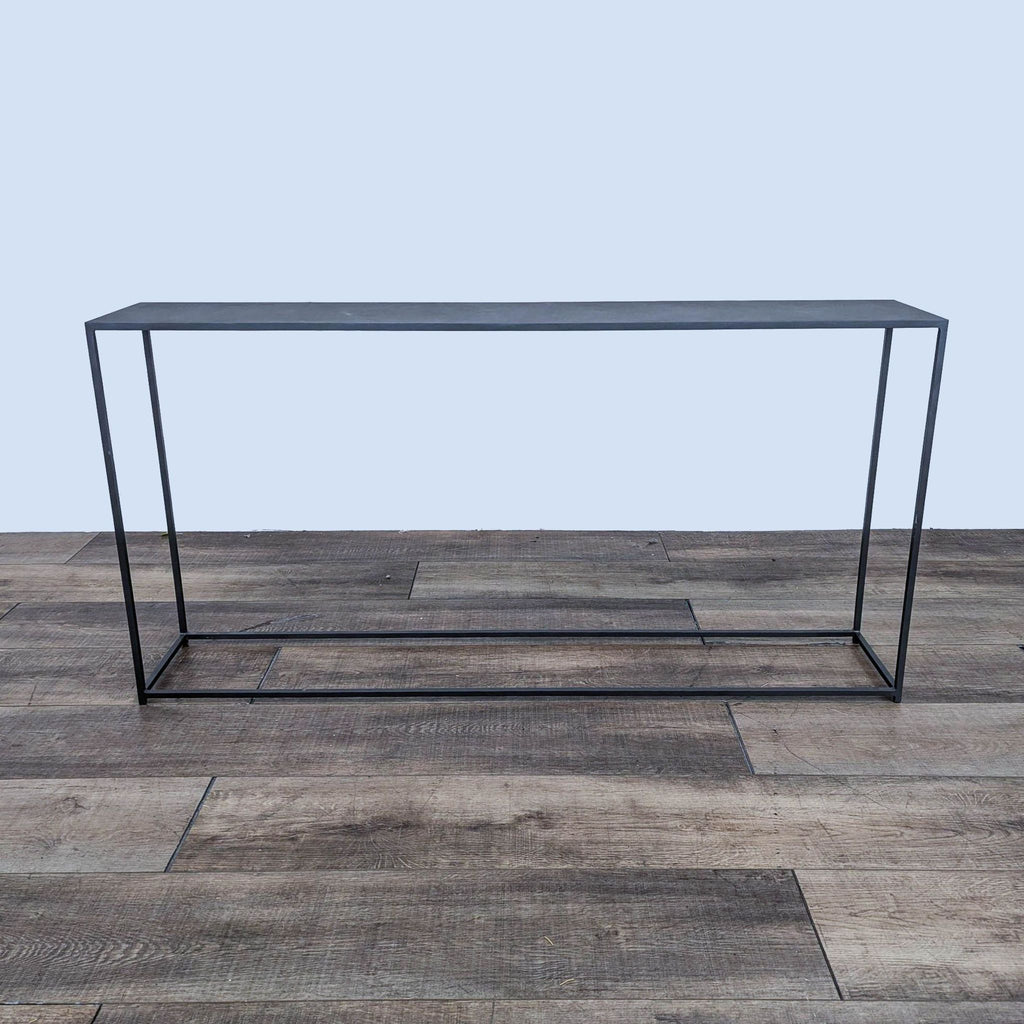 the glass coffee table is a modern coffee table with a black metal frame.