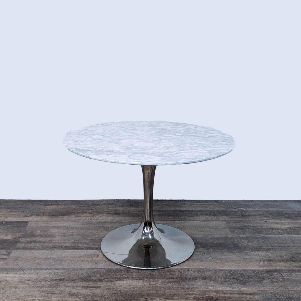 a marble table with a chrome base